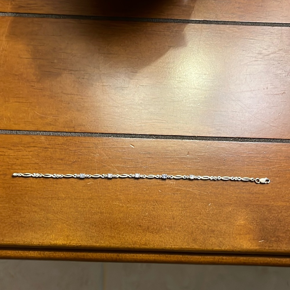 Silver bracelet with five light color Tanzanite